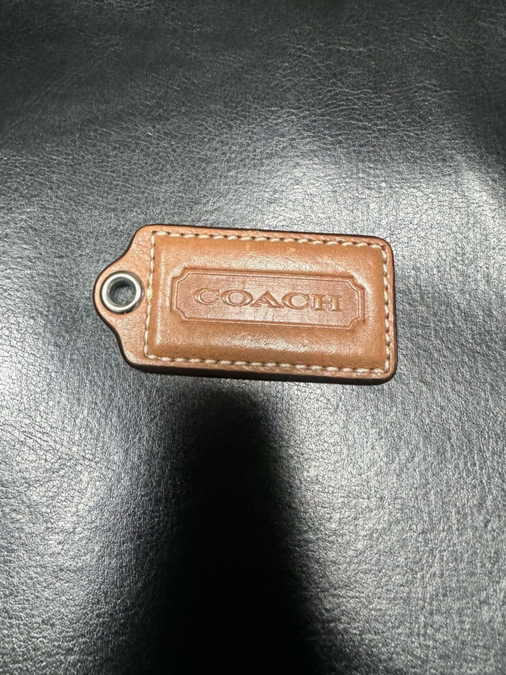 Coach 2 1/2” wide Tan Leather Key Tag with Silver Grommet
